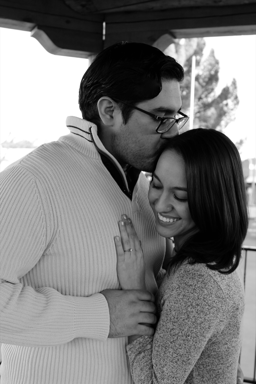 Woman laughing during a K&M couples session, in black and white