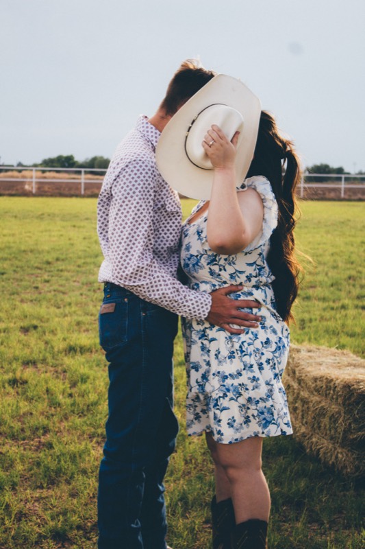 Couple embracing in a floral dress