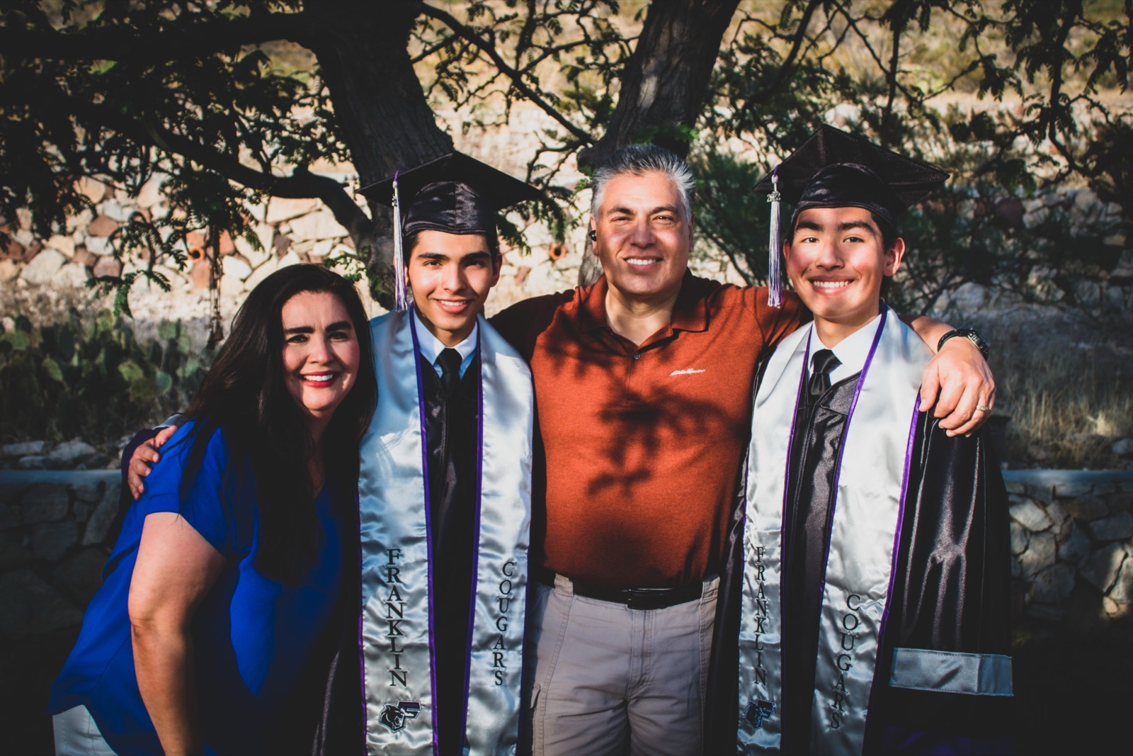Graduate celebrating with family