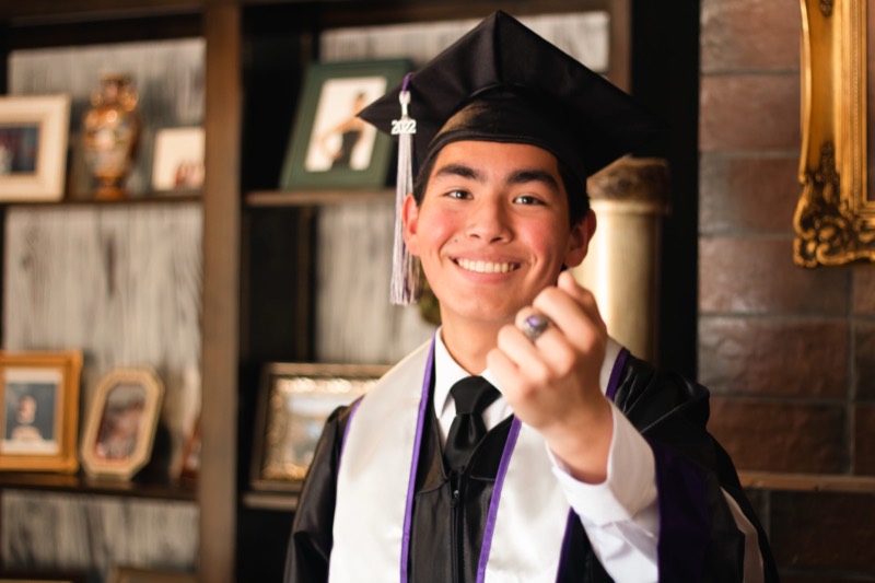 Graduate smiling in cap and gown