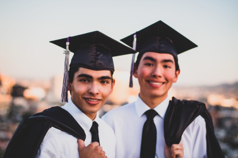 Two graduates in their caps