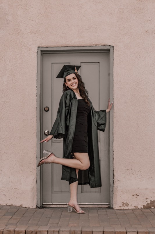 Quinceañera portrait at an adobe doorway