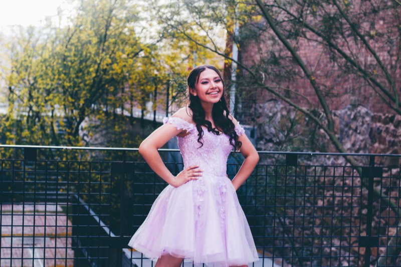 Quinceañera in a pink gown in the garden