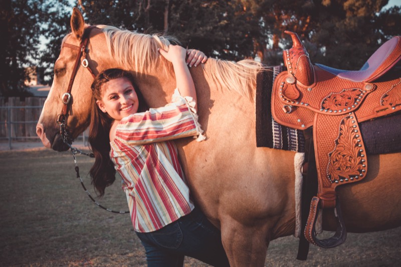 With the horse and saddle